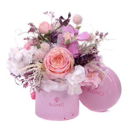 03101552_irigo-pink-blomo-s-doboz-rozsaszin-lila-es-feher-viragokbol
